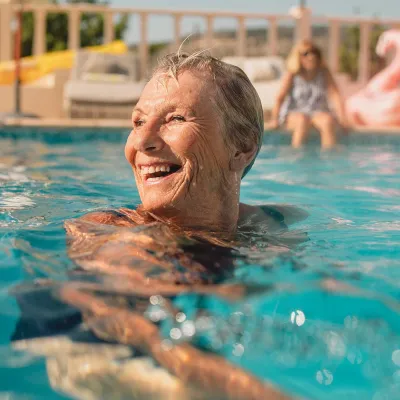 Mature woman swimming in pool