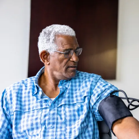 A Patient Has His Blood Pressure Taken By a Nurse in a Practice.
