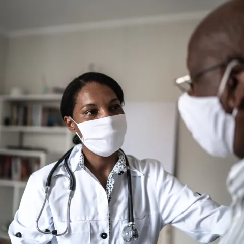 A Doctor Consoles a Patient in her Office