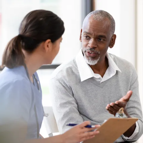 A Patient Speaks with a Provider in an Exam Room of a Medical Practice. 