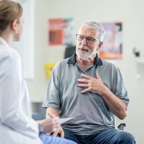 A Senior Patient Speaks to His Physician is an Exam Room