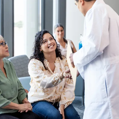 A Patient Shakes the Hand of a Physician in the Waiting Room
