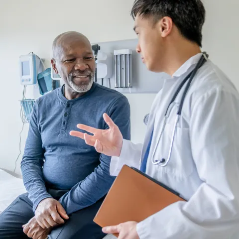 A Doctor Speaks to a Senior Couple About Their Health