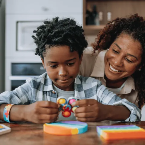 A Mother and Child do Arts-And-Crafts in the Family Kitchen