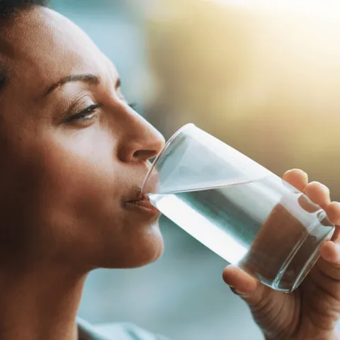 A Close Up of a Woman Drinking Water