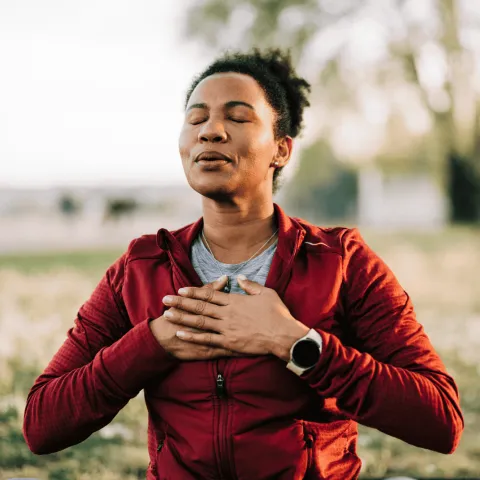 Woman taking a deep breath