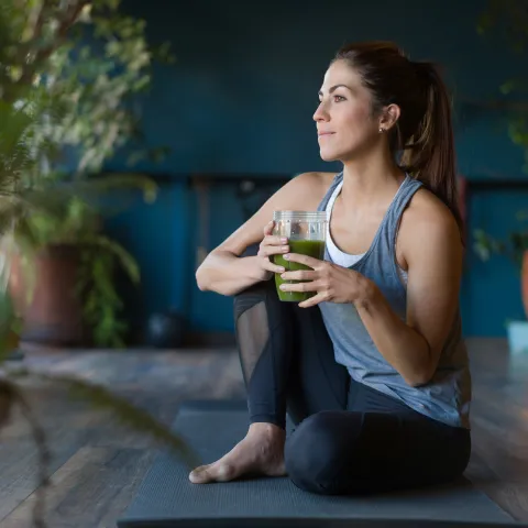 A woman stretching at home.