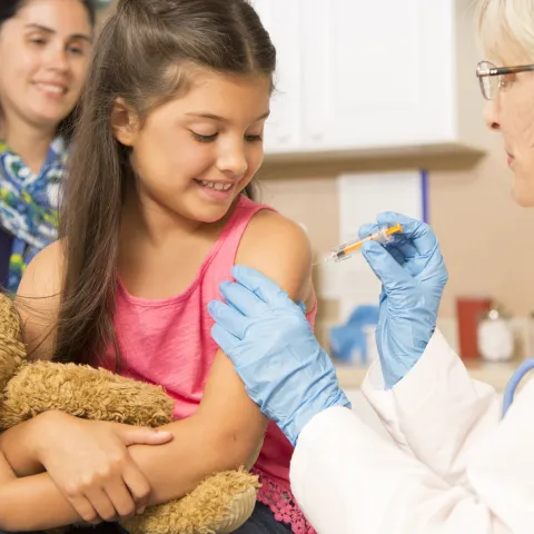 Little girl getting a flu shot