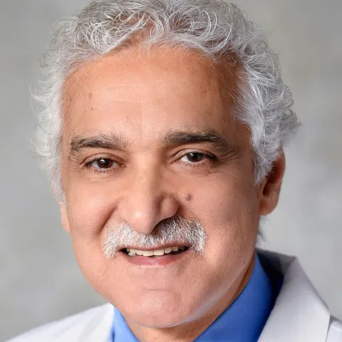 A Headshot of Author Manoucher Manoucheri