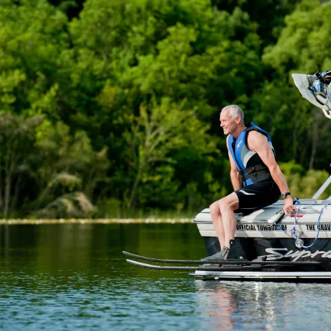 Man water skiing on lake.