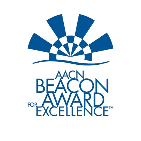 The logo for The American Association of Critical-Care Nurses (AACN) Beacon Award for Excellence