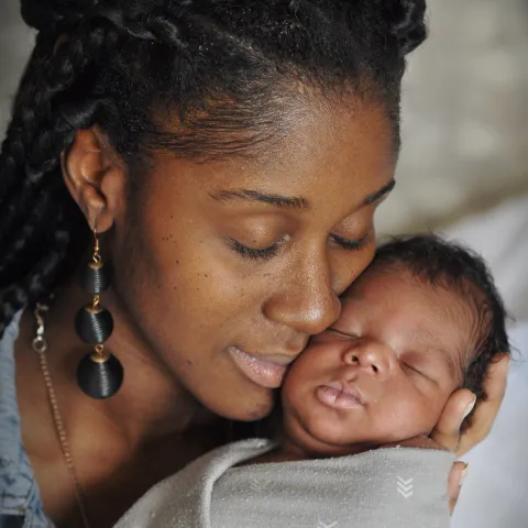 Woman holding her baby