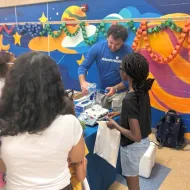 A man shows a child an experiment