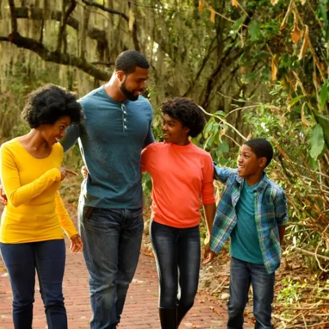 A family goes for a nature walk