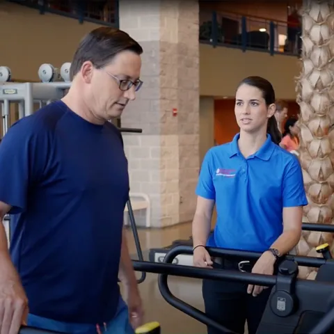 Gary and his physical therapist doing an exercise