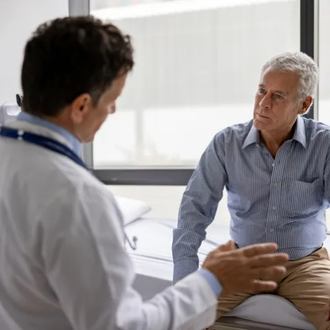 Doctor talking to a patient in a consultation at the office