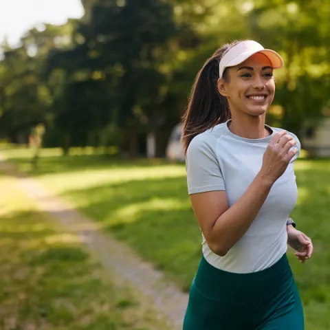 A Woman Goes For a Run in Park