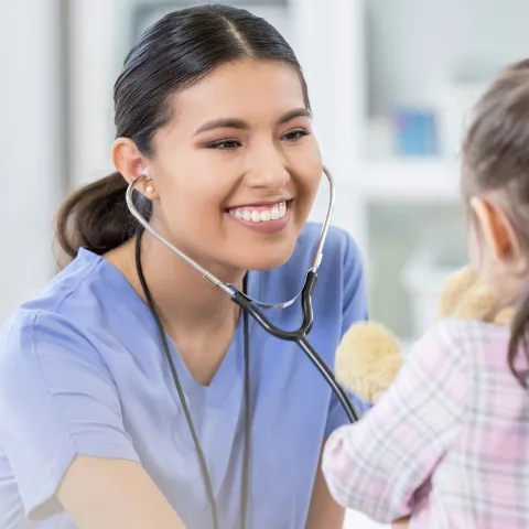Doctor seeing a pediatric patient. 