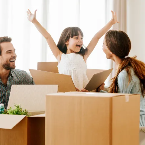 Family unpacking boxes