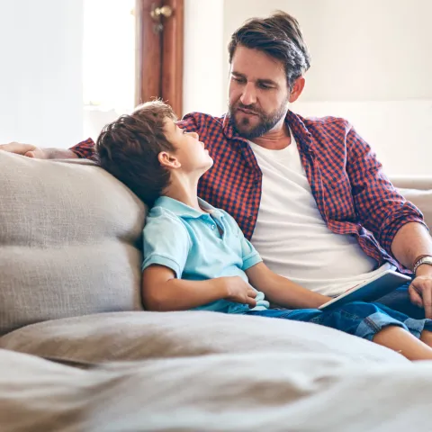A father and son have a heart to heart conversation. 