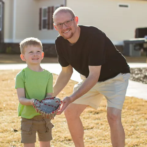 Jay Martin and his son playing baseball