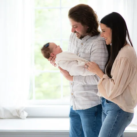 The Trapp family with their newborn daughter