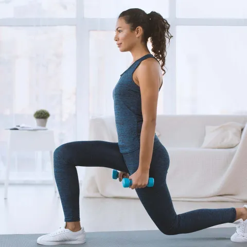 A woman exercising at home.