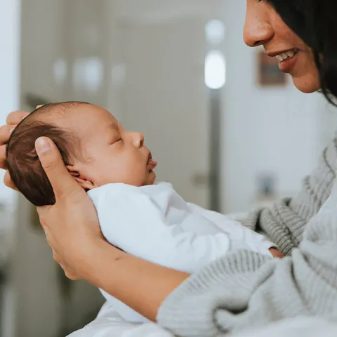 Mom holding infant