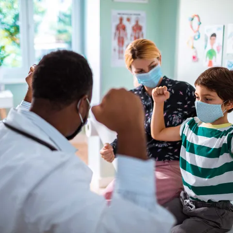 A doctor having a connecting moment with a child patient
