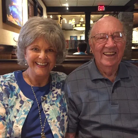 Peggy sitting with her husband, Gerald