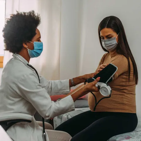 A woman getting a test done by her doctor