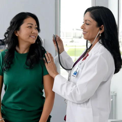 Primary Care Plus Provider with patient in clinic