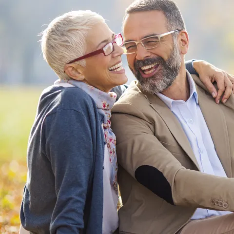 Happy, healthy couple in the park.