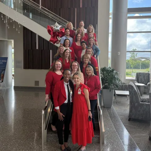 Team photo of people wearing red