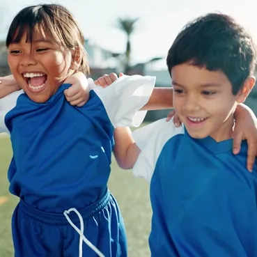 Young children playing sports.