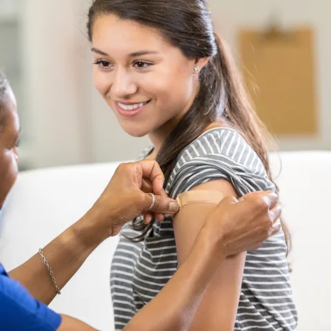 A woman receiving a vaccination 