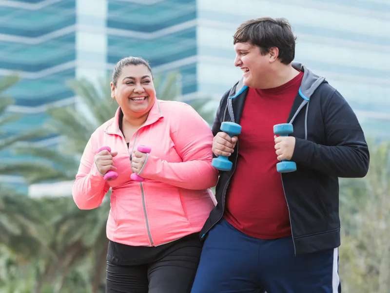 A Man and a Woman Go For a Run Outdoors