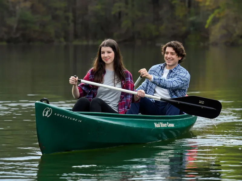 Couple having a quiet journey in a canoe.
