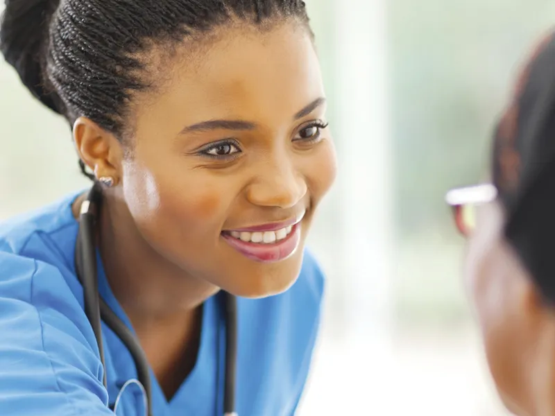 A nurse speaking with a senior patient