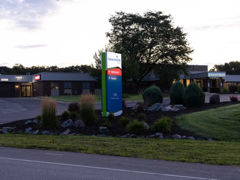 The AdventHealth Durand entrance sign shining at night.