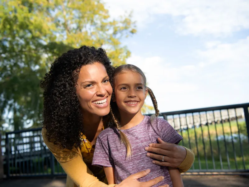 A Mother and Daughter Enjoy the Park on a Sunny Day