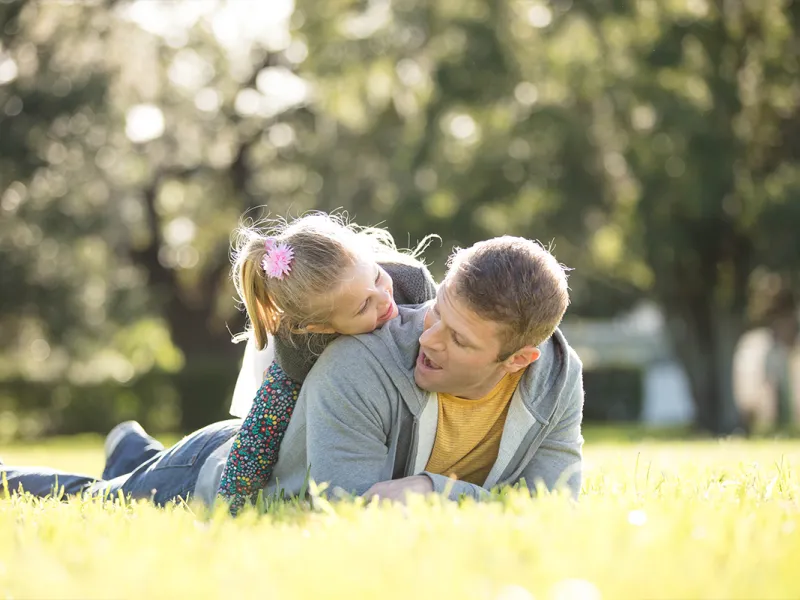 Daughter on top of dad