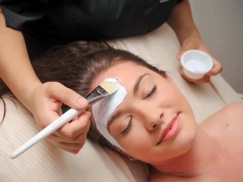 Woman getting a facial at the spa