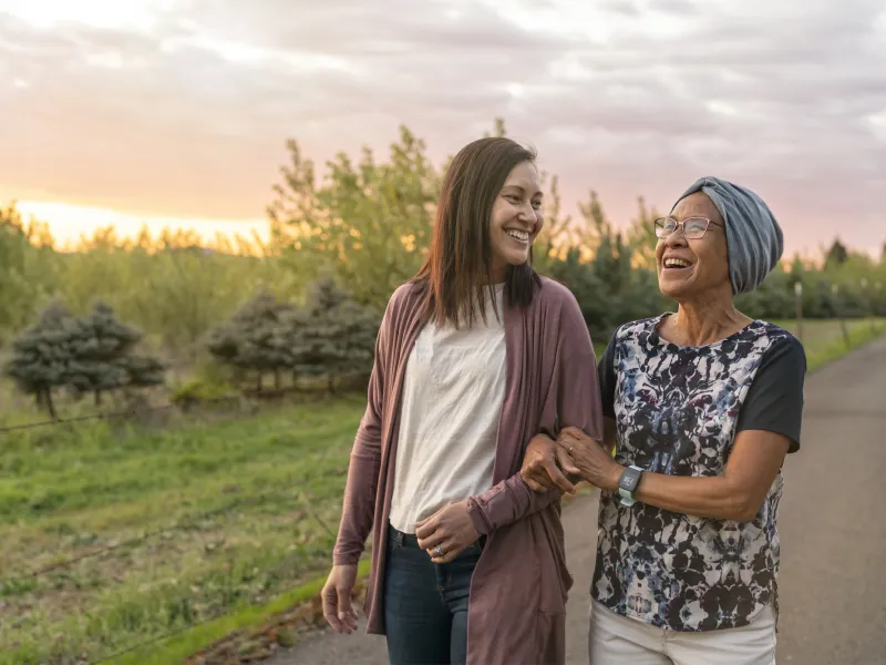 Mother and Daughter Walking Outdoors
