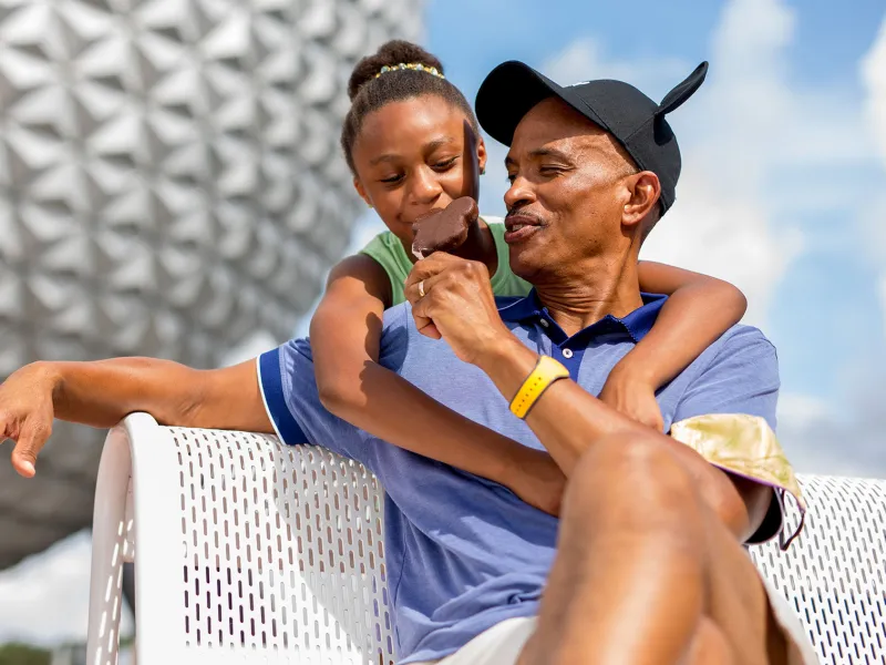 Father and Daughter at Epcot eating Ice Cream