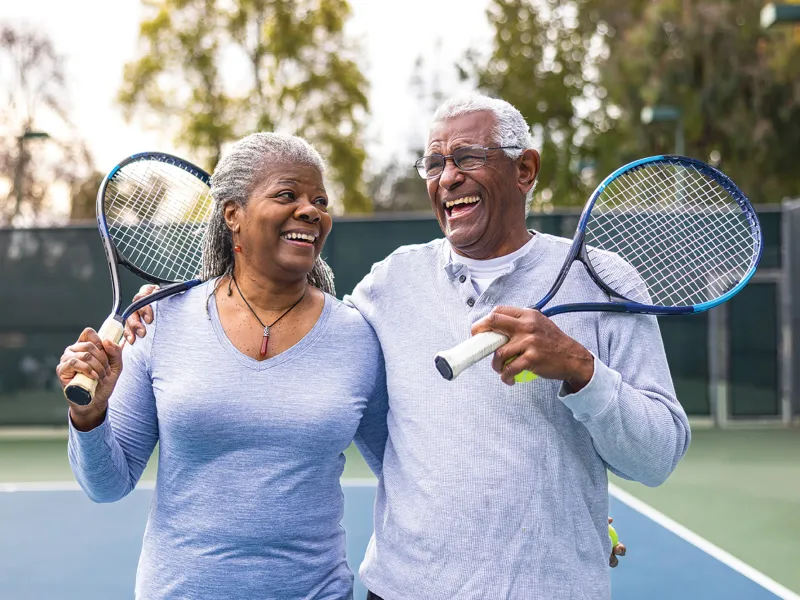 A couple playing tennis