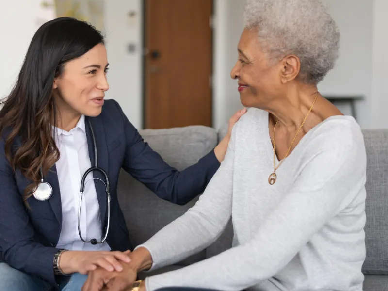 A woman talk with her doctor about what to expect following her visit.