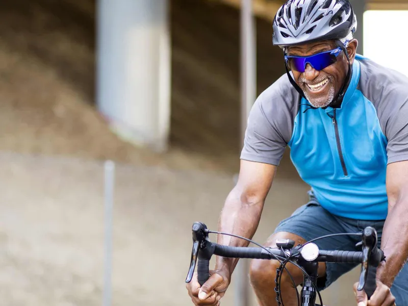 senior african american man riding a bike