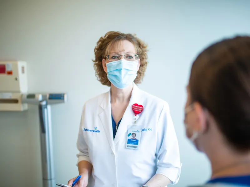 Physician talking with a patient.