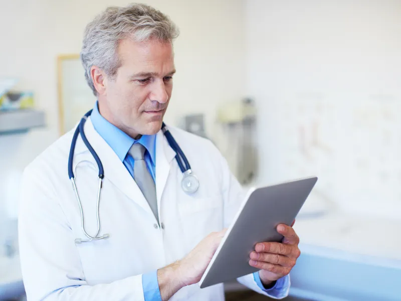 Physician on tablet